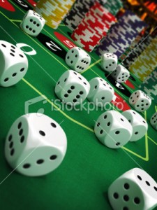 stock-photo-21094135-dices-and-poker-chips-on-green-felt